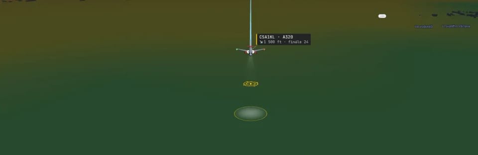 An airliner on final approach to Prague at night: landing-light cone ahead, a pool of light on the runway, gear down