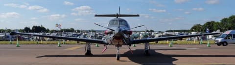Photo of a PC-12 NG of the Irish Air Corps from straight ahead, the wingtips curving up
